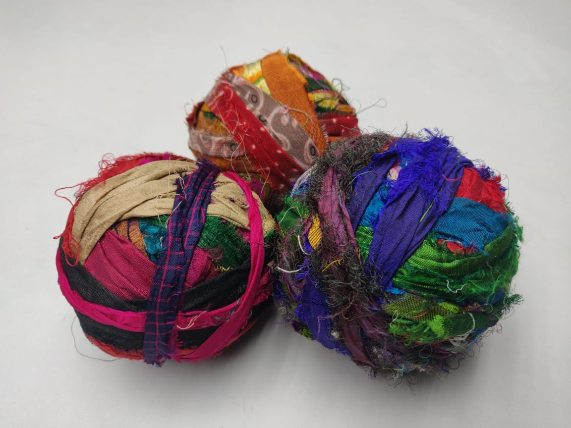 Recycled Sari silk Ribbon-Rolls is the by-product of colorful saris that women wear in India. It is the loose ends of saris collected from industrial mills in India that is torn in stripes and sewn end to end to make beautiful and col