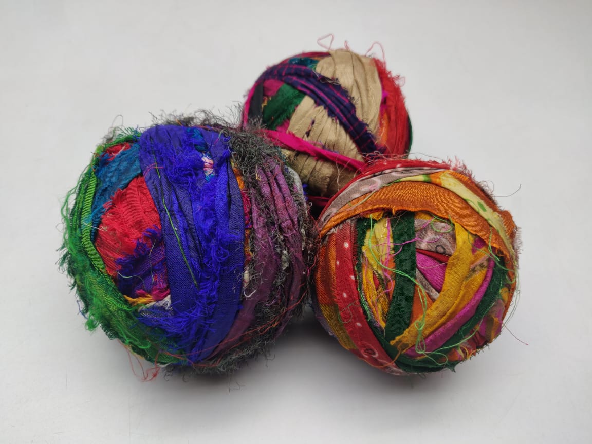 Recycled Sari silk Ribbon-Rolls is the by-product of colorful saris that women wear in India. It is the loose ends of saris collected from industrial mills in India that is torn in stripes and sewn end to end to make beautiful and col