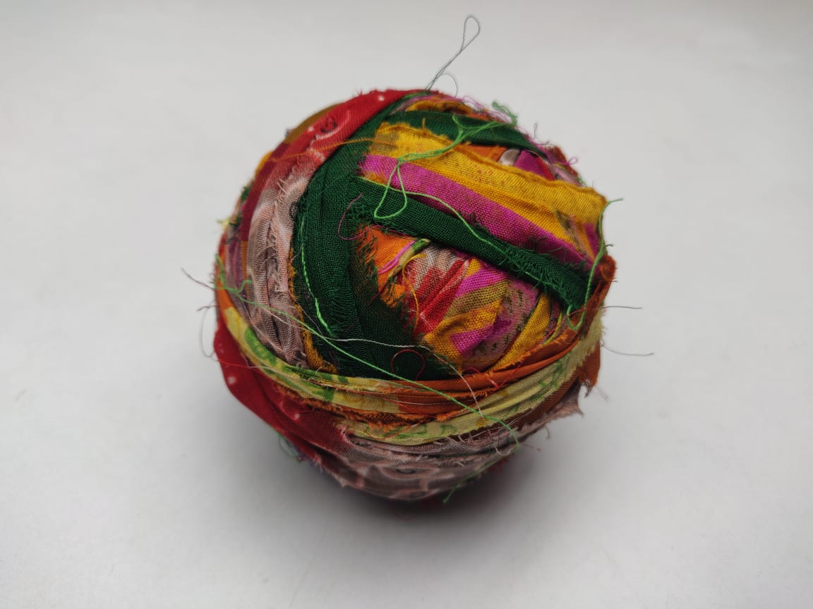 Recycled Sari silk Ribbon-Rolls is the by-product of colorful saris that women wear in India. It is the loose ends of saris collected from industrial mills in India that is torn in stripes and sewn end to end to make beautiful and col