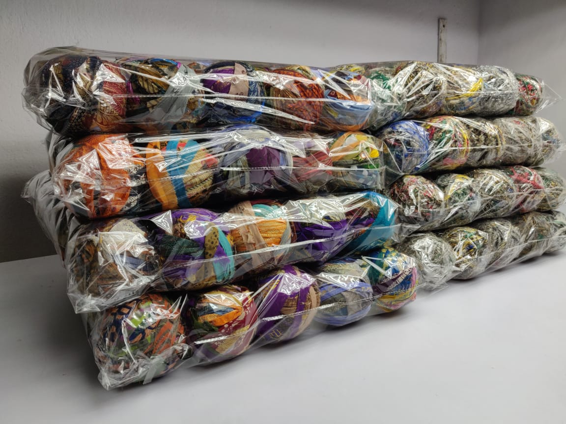 Recycled Sari silk Ribbon-Rolls is the by-product of colorful saris that women wear in India. It is the loose ends of saris collected from industrial mills in India that is torn in stripes and sewn end to end to make beautiful and col