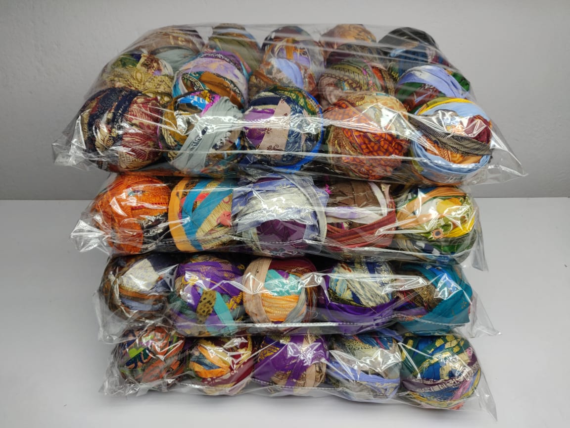 Recycled Sari silk Ribbon-Rolls is the by-product of colorful saris that women wear in India. It is the loose ends of saris collected from industrial mills in India that is torn in stripes and sewn end to end to make beautiful and col