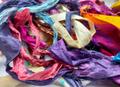 This ribbons scraps is made of completely recycled Sari material from recycled clothing. We work with women’s Cooperative in the countryside to produce this unique ribbons and other hand knitted silk yarn products. Women make this ribbons and various knitwear in their homes while not neglecting their other household chores. This work provides additional income to support and improve their family earnings.