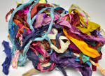 This ribbons scraps is made of completely recycled Sari material from recycled clothing. We work with women’s Cooperative in the countryside to produce this unique ribbons and other hand knitted silk yarn products. Women make this ribbons and various knitwear in their homes while not neglecting their other household chores. This work provides additional income to support and improve their family earnings.