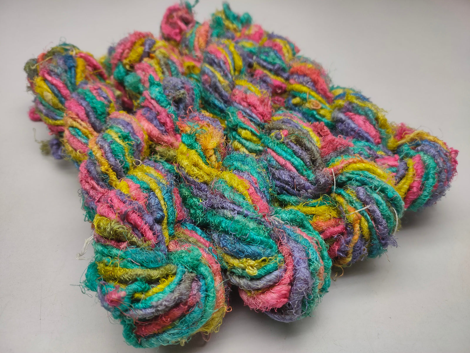 Recycle Sari Silk Yarn are the remnants of traditionally crafted Indian Saris and are extensively used in making hats, mittens, hued scarves, etc. We offer Recycle Sari Silk Yarn comprising of 100% and they are not over spun unlike some natural yarn. Each skein has distinct color, gauge, twist and texture. Varying in weight, our Recycled Sari Yarn are hailed for their quality and strength.