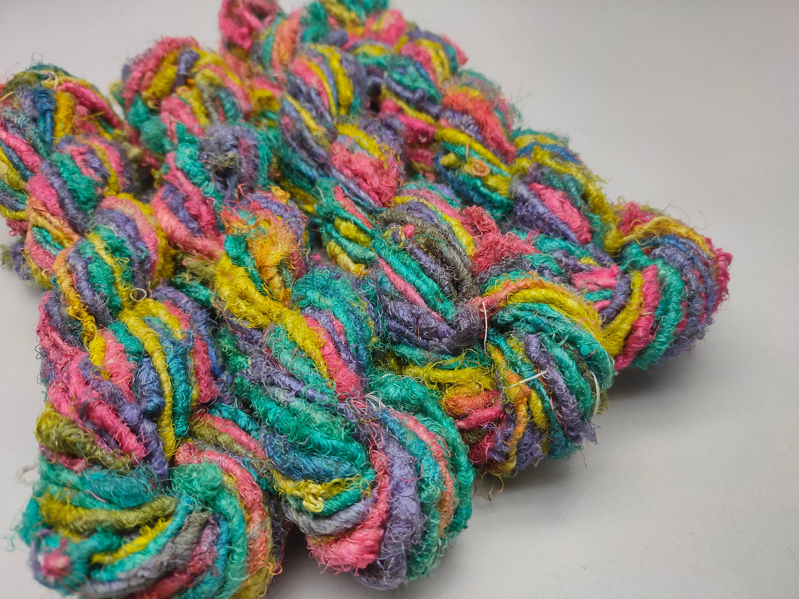 Recycle Sari Silk Yarn are the remnants of traditionally crafted Indian Saris and are extensively used in making hats, mittens, hued scarves, etc. We offer Recycle Sari Silk Yarn comprising of 100% and they are not over spun unlike some natural yarn. Each skein has distinct color, gauge, twist and texture. Varying in weight, our Recycled Sari Yarn are hailed for their quality and strength.