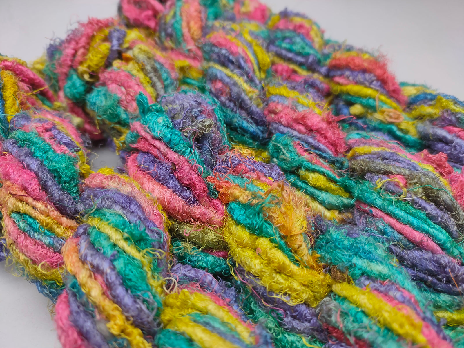 Recycle Sari Silk Yarn are the remnants of traditionally crafted Indian Saris and are extensively used in making hats, mittens, hued scarves, etc. We offer Recycle Sari Silk Yarn comprising of 100% and they are not over spun unlike some natural yarn. Each skein has distinct color, gauge, twist and texture. Varying in weight, our Recycled Sari Yarn are hailed for their quality and strength.