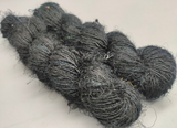 Recycled Sari Silk Yarn Prime - Black is available in multitude of colors, and being premium, you get extra length of yarn in the same weight. We fabricate Himalaya Silk Yarn from the bi-product of sari and silk production units. The Yarn, available with us, is hand spun into bright hanks which is suitable for number of Handicrafts applications.