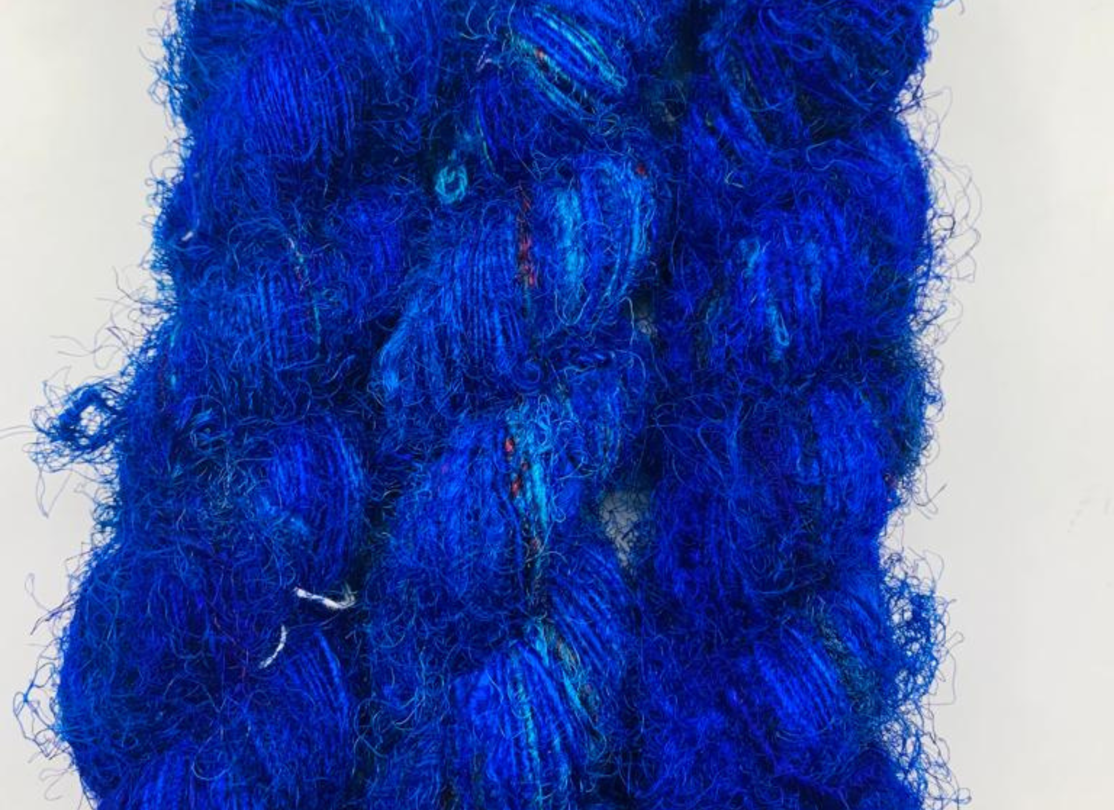 Recycled Sari Silk Yarn Prime - Indigo is available in multitude of colors, and being premium, you get extra length of yarn in the same weight. We fabricate Himalaya Silk Yarn from the bi-product of sari and silk production units. 