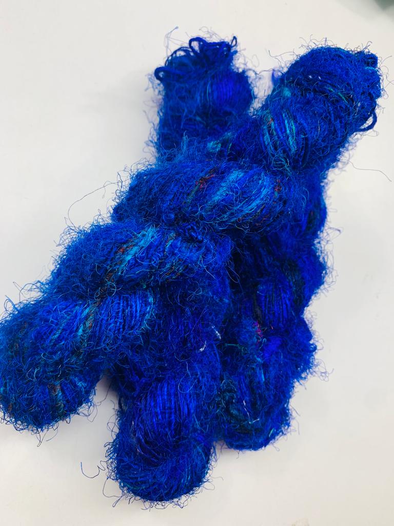 Recycled Sari Silk Yarn Prime - Indigo is available in multitude of colors, and being premium, you get extra length of yarn in the same weight. We fabricate Himalaya Silk Yarn from the bi-product of sari and silk production units. 