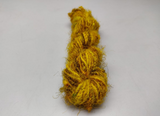 Recycled Sari Silk Yarn - Turmeric is available in multitude of colors, and being premium, you get extra length of yarn in the same weight. We fabricate Recycle Sari Silk Yarn from the bi-product of sari and silk production units.