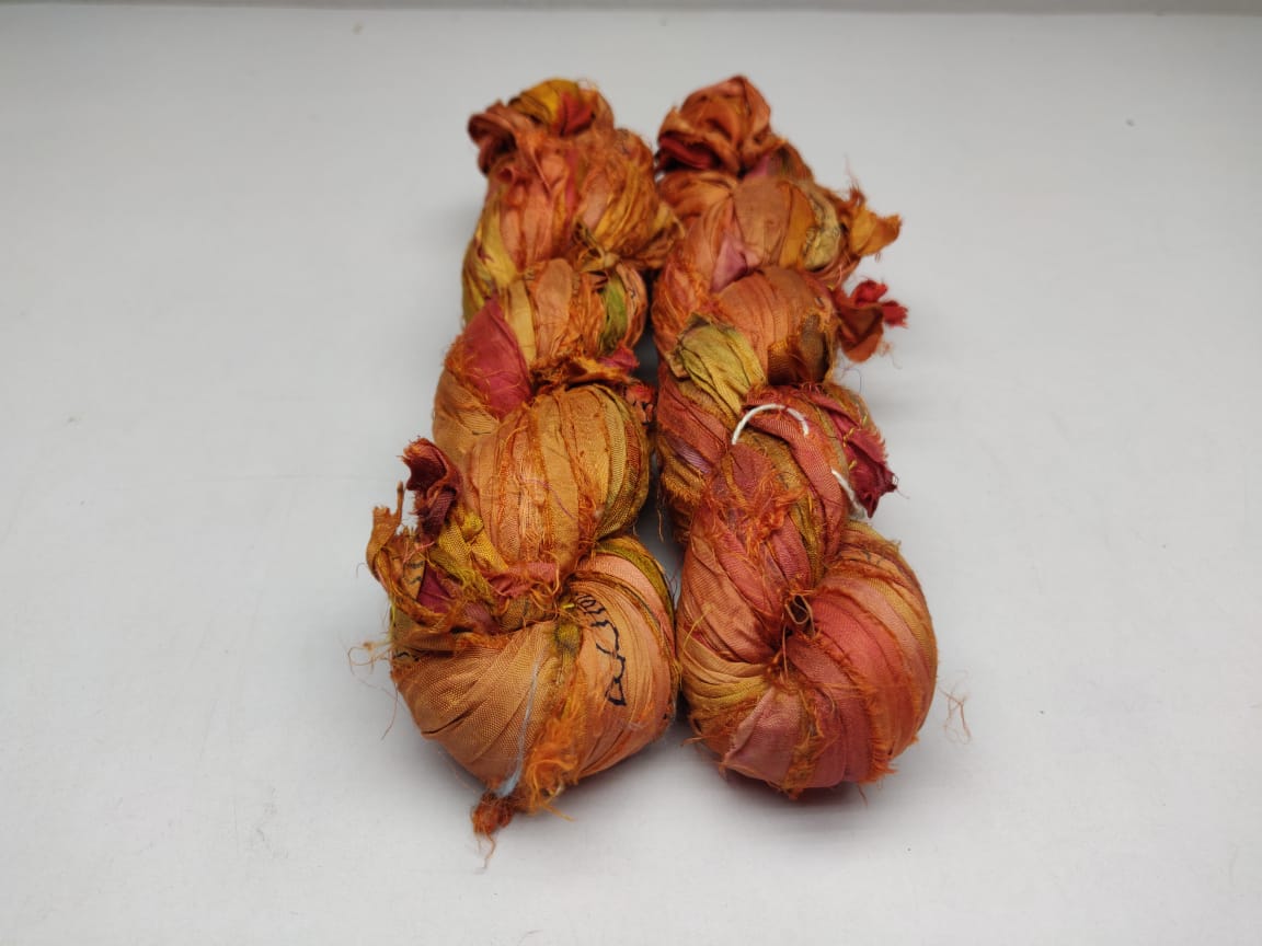 Recycled Sari silk Ribbon is the by-product of colorful saris that women wear in India. It is the loose ends of saris collected from industrial mills in India that is torn in stripes and sewn end to end to make beautiful and colorful ribbons. The vibrant colors and unique texture of these silk fabric,