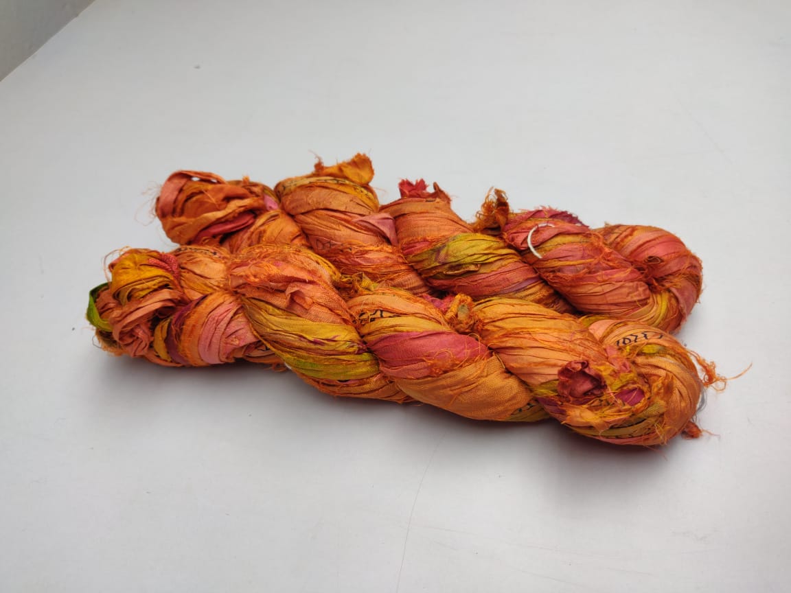 Recycled Sari silk Ribbon is the by-product of colorful saris that women wear in India. It is the loose ends of saris collected from industrial mills in India that is torn in stripes and sewn end to end to make beautiful and colorful ribbons. The vibrant colors and unique texture of these silk fabric,