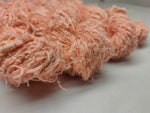 Recycled Linen Yarn - Peach is made from leftover or excessive warp/ weft thread on handlooms/ powerloom, to be specific the byproduct linen from industrial Linen weaving unit in India. This recycle yarn is hand-spun, using drop spindle helping women cooperatives to earn their livelihood
