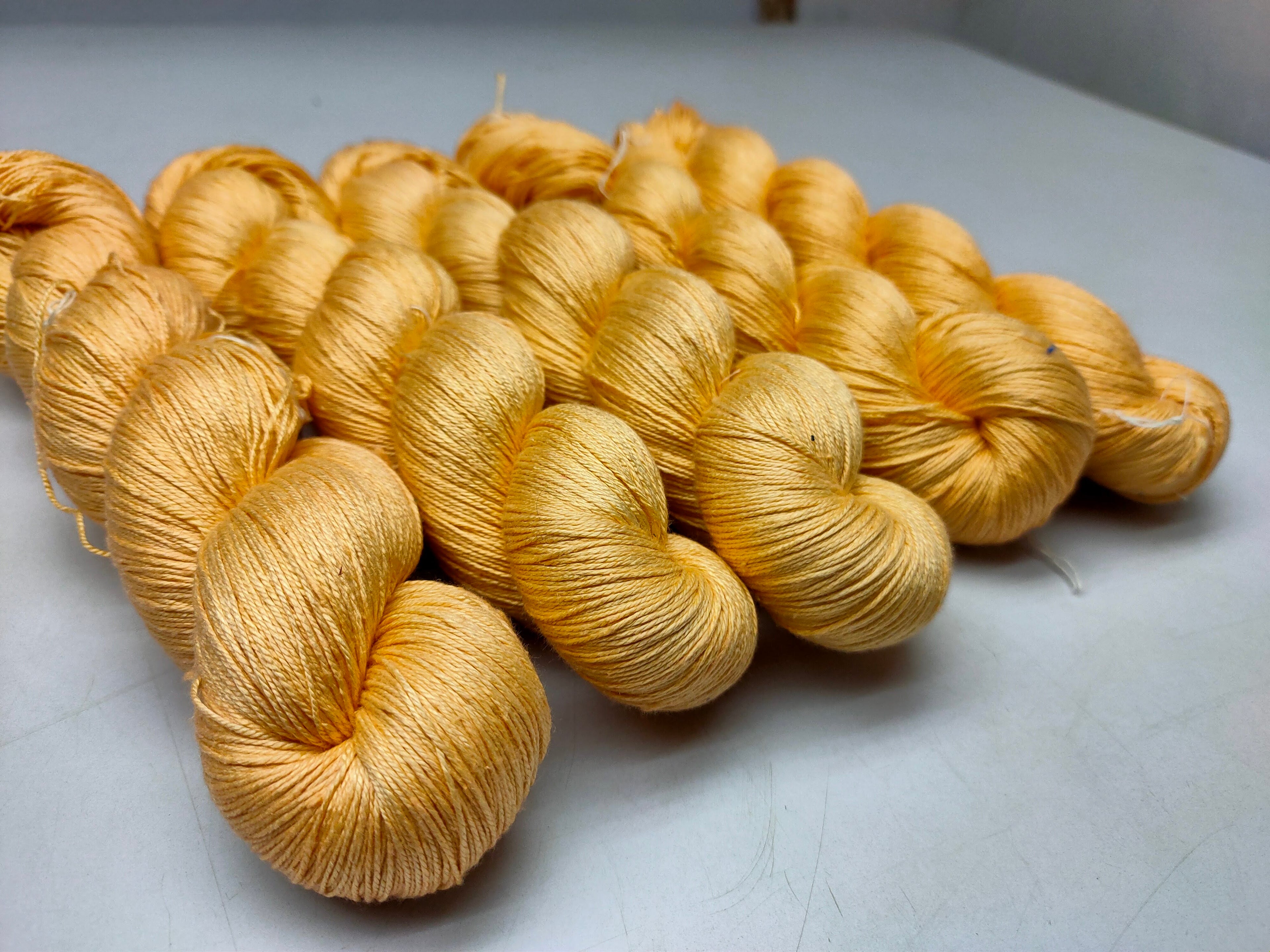 Mulberry Silk yarn (600 mts in 100gram) is a unique Silk Yarn ideal for Knitting. Mulberry Silk is very soft and shiny. It is Sock weight and is directly spun from the premium Mulberry Silk Tops. It is a yarn of Natural Protein Fiber. Mulberry Silk Yarn has compact structure, evenness, clean appearance, elegant luster, Good moisture-absorbing capability, good strength and elongation, with fine and soft fibers. It is useful for Weaving and Knitting.