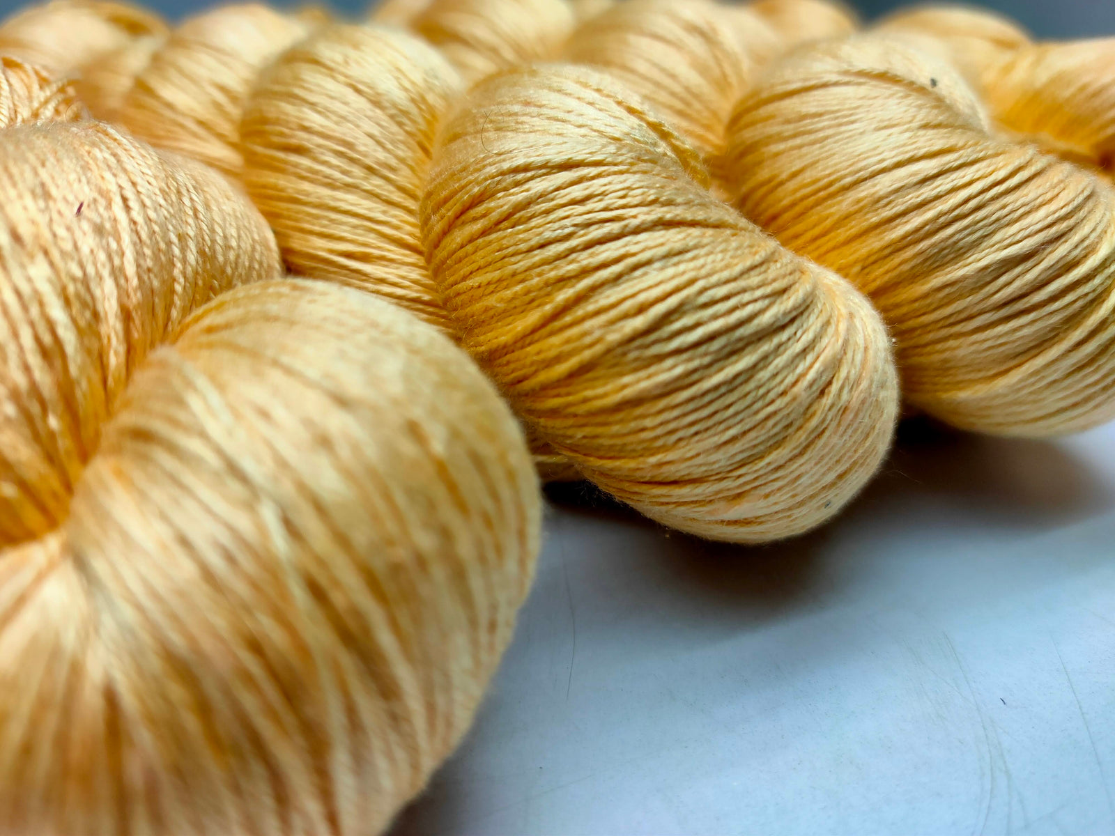 Mulberry Silk yarn (600 mts in 100gram) is a unique Silk Yarn ideal for Knitting. Mulberry Silk is very soft and shiny. It is Sock weight and is directly spun from the premium Mulberry Silk Tops. It is a yarn of Natural Protein Fiber. Mulberry Silk Yarn has compact structure, evenness, clean appearance, elegant luster, Good moisture-absorbing capability, good strength and elongation, with fine and soft fibers. It is useful for Weaving and Knitting.