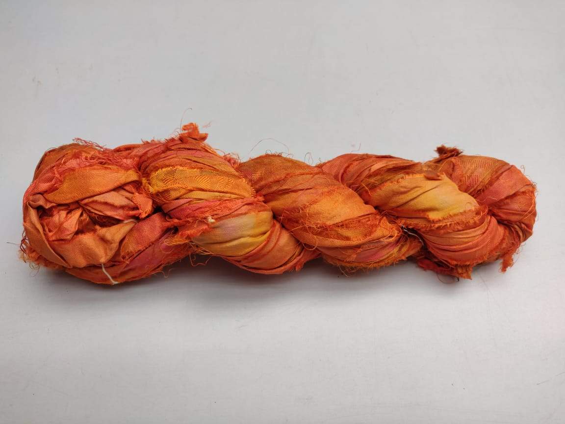 Recycled Sari Silk Ribbon - Fire - SilkRouteIndiaRecycled Sari silk Ribbon is the by-product of colorful saris that women wear in India. It is the loose ends of saris collected from industrial mills in India that is torn in stripes and sewn end to end to make beautiful and colorful ribbons. The vibrant colors and unique texture of these silk fabric,