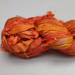 Recycled Sari Silk Ribbon - Fire - SilkRouteIndiaRecycled Sari silk Ribbon is the by-product of colorful saris that women wear in India. It is the loose ends of saris collected from industrial mills in India that is torn in stripes and sewn end to end to make beautiful and colorful ribbons. The vibrant colors and unique texture of these silk fabric,