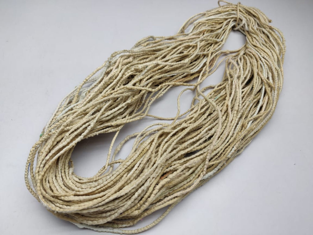 Cording Sari Silk Ribbon - Multicolor - SilkRouteIndiaCording Sari Silk Ribbon - Multicolor - SilkRouteIndiaFair Trade Recycled Lurex Hemmed Cording Sari Silk Ribbon yarn. Very sparkling! Made from Recycled Sari silk Ribbon which is the by-product of colorful saris that women wear in India. It is the loose ends of saris collected from industrial mills in India that is torn in stripes and sewn end to end to make beautiful and colorful ribbons. The vibrant colors and unique texture of these silk fabric, the s