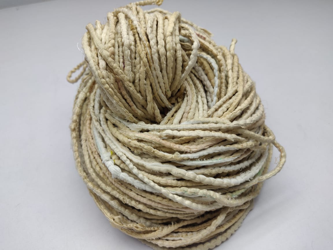 Cording Sari Silk Ribbon - Multicolor - SilkRouteIndiaFair Trade Recycled Lurex Hemmed Cording Sari Silk Ribbon yarn. Very sparkling! Made from Recycled Sari silk Ribbon which is the by-product of colorful saris that women wear in India. It is the loose ends of saris collected from industrial mills in India that is torn in stripes and sewn end to end to make beautiful and colorful ribbons. The vibrant colors and unique texture of these silk fabric, the s