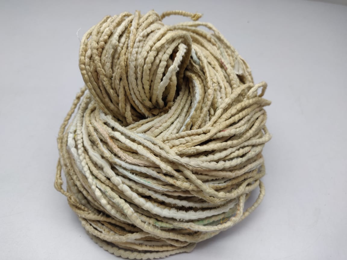 Cording Sari Silk Ribbon - Multicolor - SilkRouteIndiaFair Trade Recycled Lurex Hemmed Cording Sari Silk Ribbon yarn. Very sparkling! Made from Recycled Sari silk Ribbon which is the by-product of colorful saris that women wear in India. It is the loose ends of saris collected from industrial mills in India that is torn in stripes and sewn end to end to make beautiful and colorful ribbons. The vibrant colors and unique texture of these silk fabric, the s