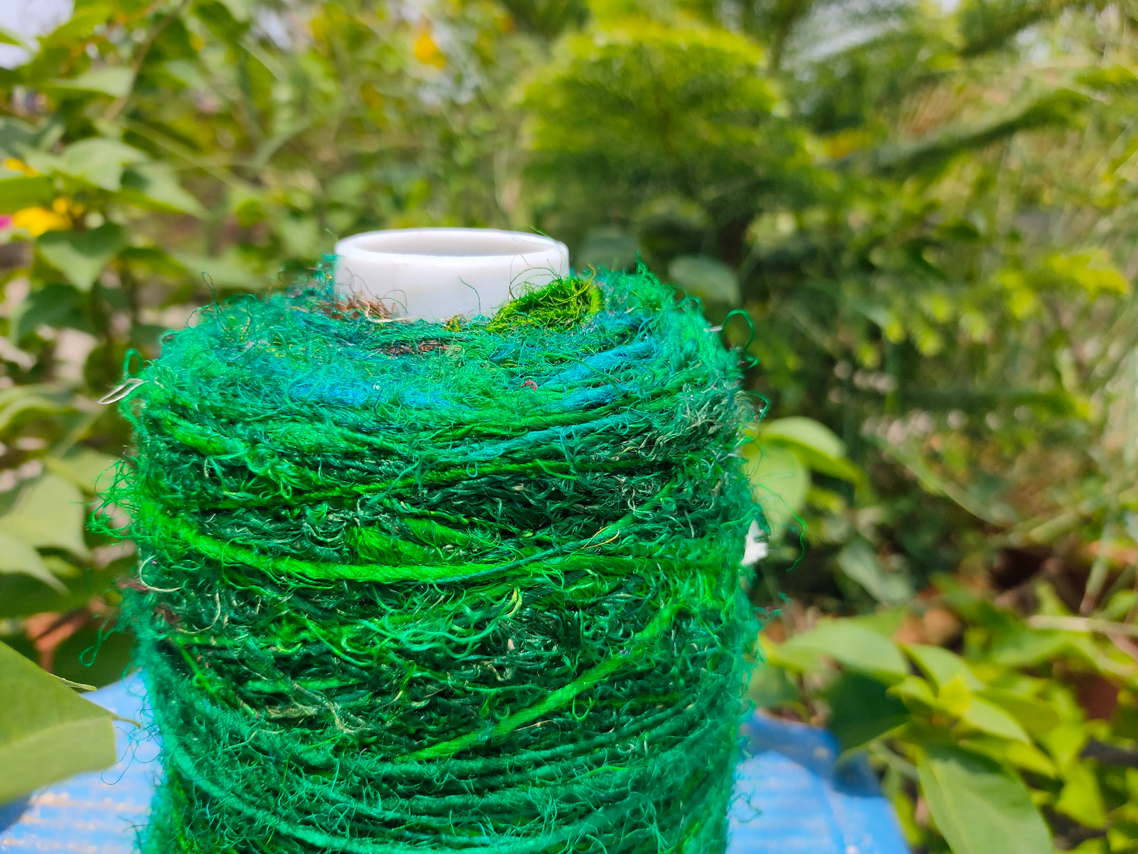 Recycle Sari silk Yarn Prime - Green that is available in multitude of colors, and being premium, you get extra length of yarn in the same weight. We fabricate Sari Silk Yarn from the bi-product of sari and silk production units. The Yarn, available with us, is hand spun into bright hanks which is suitable for number of Handicrafts applications. Sari Silk yarn comes with various fiber mixes that also happens to help people and the planet.