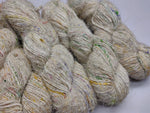 Recycled Sari Silk Yarn Prime Cream Patches - SilkRouteIndia - Recycled Sari Silk Yarn Prime is available in multitude of colors, and being premium, you get extra length of yarn in the same weight. We fabricate Recycled Silk Yarn from the bi-product of sari and silk production units.
