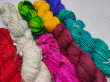 10 Colors Recycled Sari Silk Yarn Prime - SilkRouteIndia - 10 Colors Recycled Sari Silk Yarn Prime - SilkRouteIndia - We fabricate Recycled Sari Silk Yarn(Prime*) from the bi-product of sari and silk production units. The Yarn, available with me, is hand spun into bright hanks initially and later is been converted to Balls which is suitable for number of Handicrafts applications. Recycle Sari Silk Yarn comes with various fiber mixes that also happens to help people and the planet. 