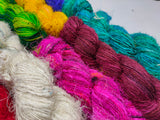 10 Colors Recycled Sari Silk Yarn Prime - SilkRouteIndia - Recycled Sari Silk Yarn is available in multitude of colors, and being premium, you get extra length of yarn in the same weight. We fabricate Recycle Sari Silk Yarn from the bi-product of sari and silk production units. The Yarn, available with us, is hand spun into bright hanks 
