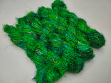 Recycled Sari Silk Yarn Green - SilkRouteIndia - Recycled Sari Silk Yarn is available in multitude of colors, and being premium, you get extra length of yarn in the same weight. We fabricate Recycle Sari Silk Yarn from the bi-product of sari and silk production units. The Yarn, available with us, is hand spun into bright hanks 