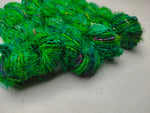 Recycled Sari Silk Yarn Green - SilkRouteIndia - Recycled Sari Silk Yarn is available in multitude of colors, and being premium, you get extra length of yarn in the same weight. We fabricate Recycle Sari Silk Yarn from the bi-product of sari and silk production units. The Yarn, available with us, is hand spun into bright hanks 