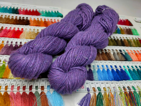 Noil Silk Yarn Purple - SilkRouteIndia - Silk Noil Yarn is made from the short fibers of the cocoon from combing of silk and is very soft in nature. This has alook of wool, feel of soft cotton and a luxury of Silk. Ideally used for Weaving, Knitting and Crocheting proje