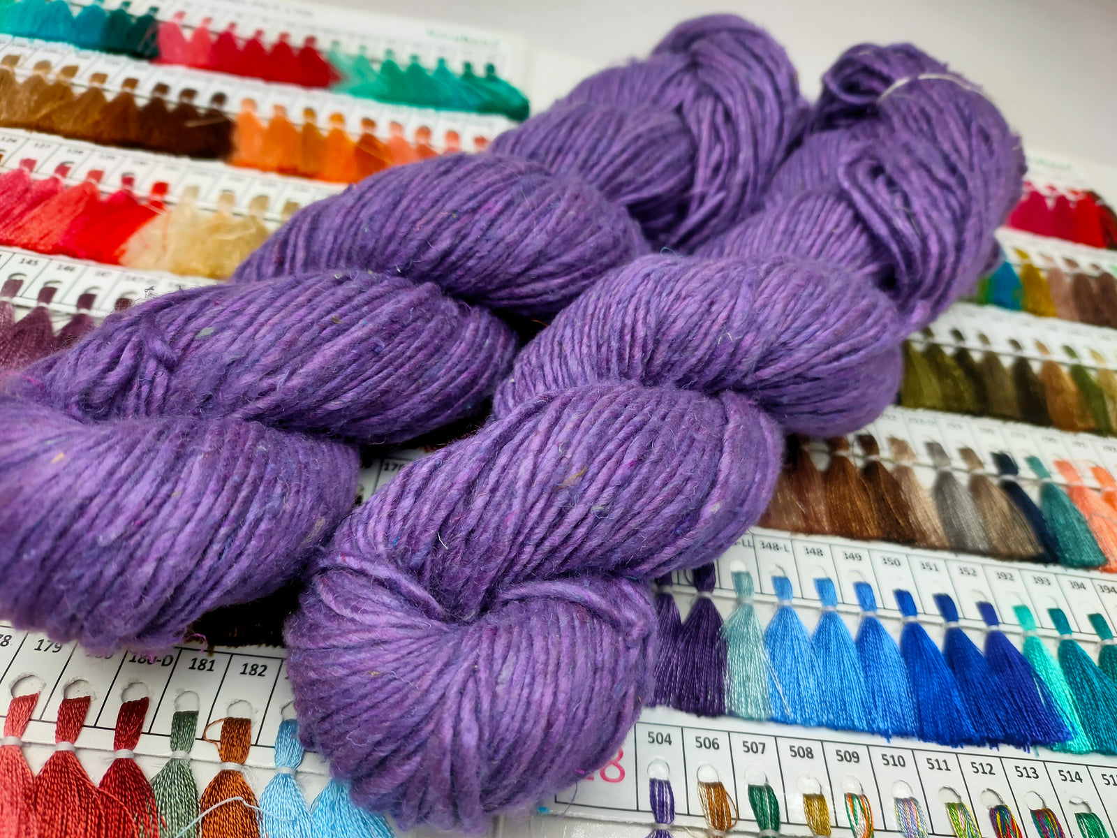 Noil Silk Yarn Purple - SilkRouteIndiaSilk Noil Yarn is made from the short fibers of the cocoon from combing of silk and is very soft in nature. This has alook of wool, feel of soft cotton and a luxury of Silk. Ideally used for Weaving, Knitting and Crocheting project