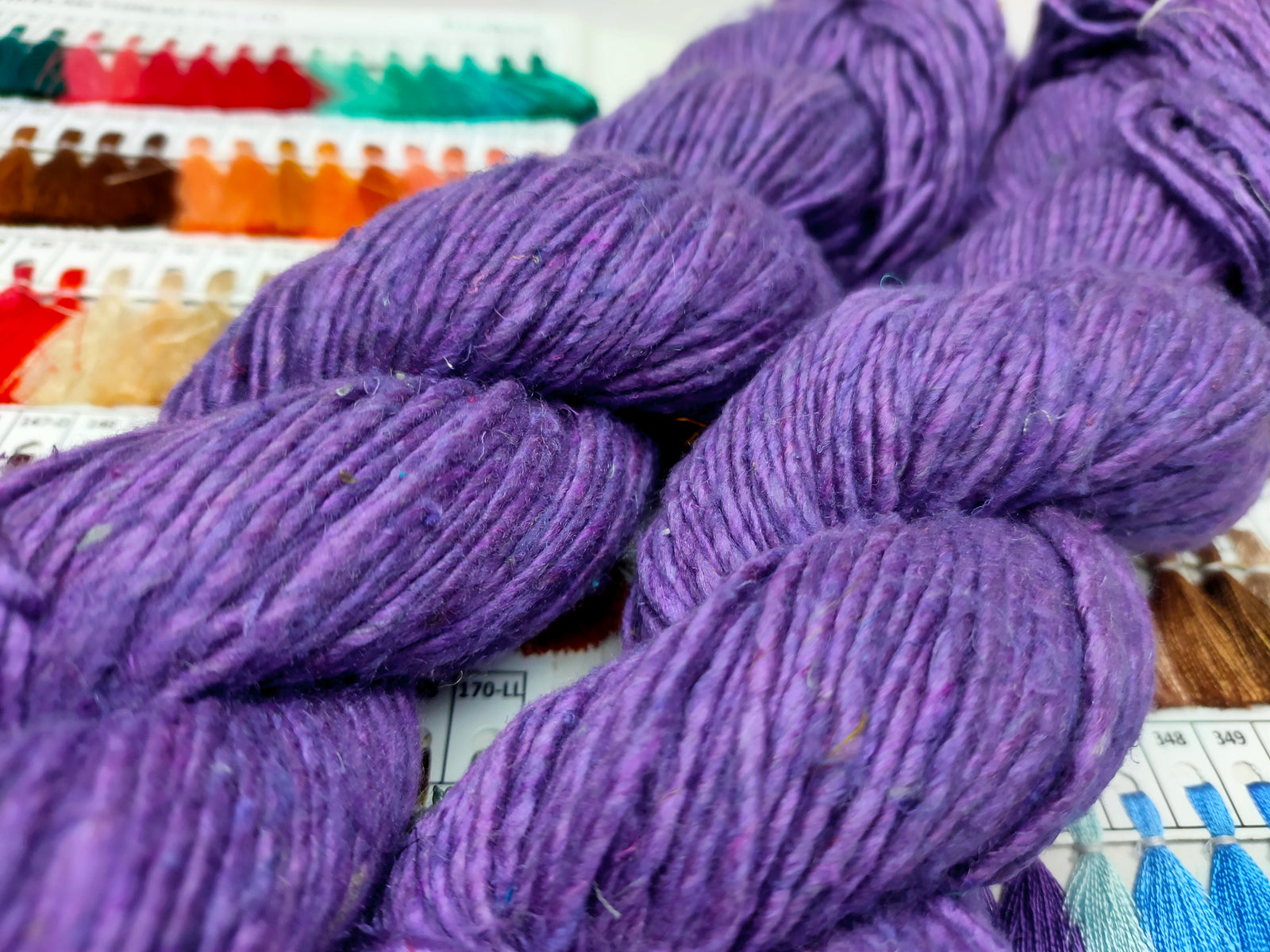 Noil Silk Yarn Purple - SilkRouteIndiaSilk Noil Yarn is made from the short fibers of the cocoon from combing of silk and is very soft in nature. This has alook of wool, feel of soft cotton and a luxury of Silk. Ideally used for Weaving, Knitting and Crocheting proje