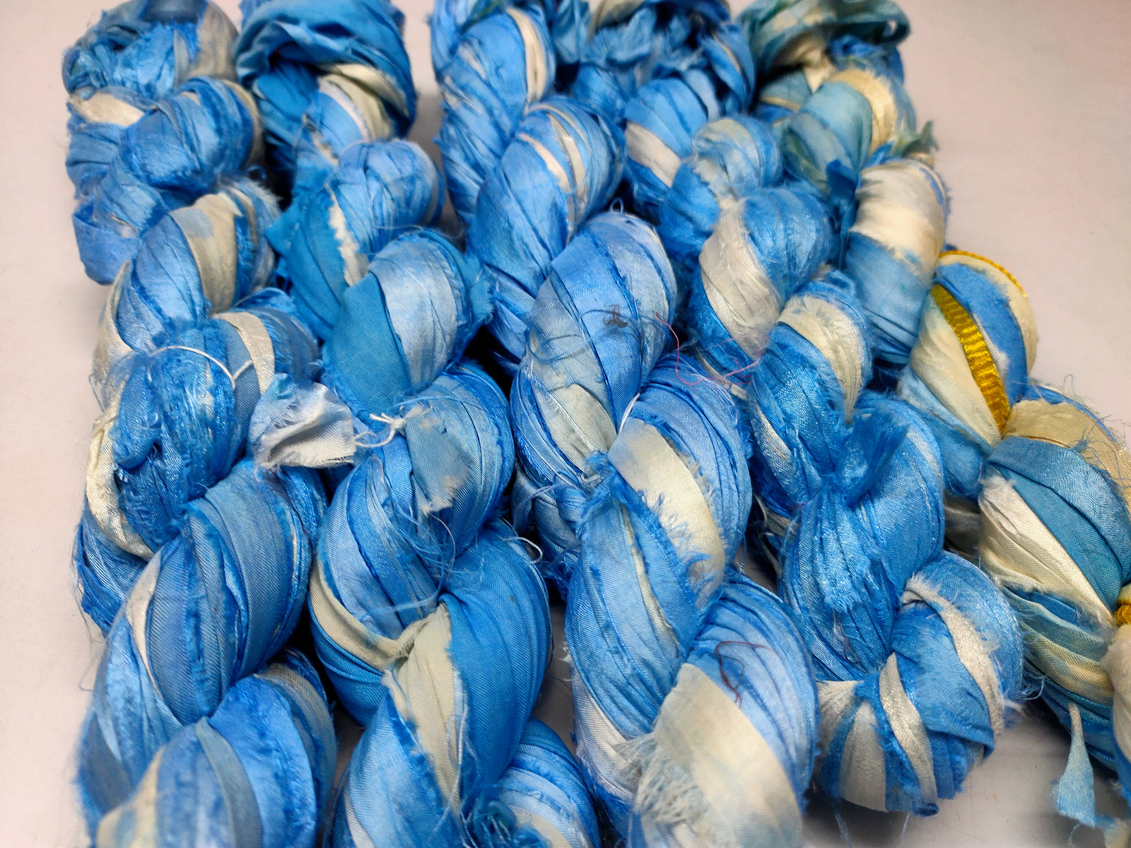 Recycled Sari Silk Ribbon - Cloud - SilkRouteIndia Recycled Sari SilK yarn, Recycled Sari Silk Ribbon, Recycled Sari yarn, Recycled Silk Ribbon,upcycled ribbon, upcycled yarn, Himalaya Silk Yarn, Recycle Sari silk,	Recycle Silk,	Yarn for Knitting,	Knitting Yarn,	Crochet Yarn,	handcrafted yarn,	recycle sari yarn,	Sari Silk Yarn, reused ribbon, recycled ribbon