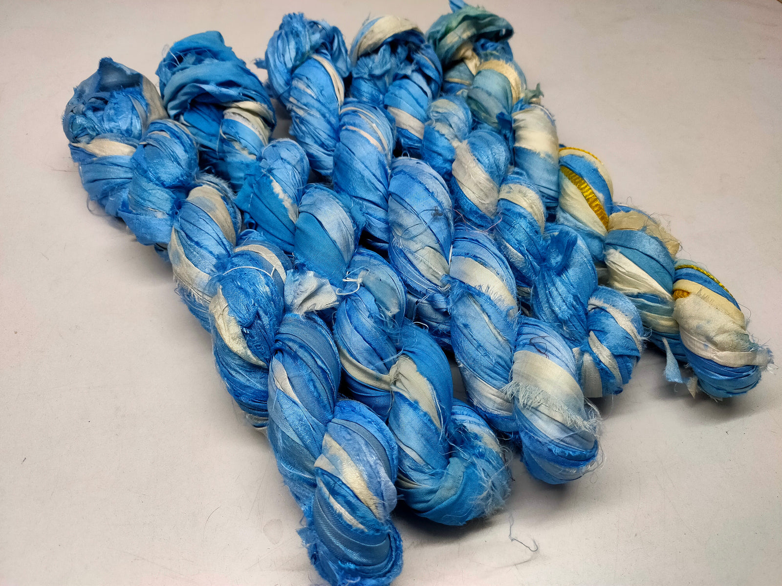 Recycled Sari Silk Ribbon - Cloud - SilkRouteIndia Recycled Sari SilK yarn, Recycled Sari Silk Ribbon, Recycled Sari yarn, Recycled Silk Ribbon,upcycled ribbon, upcycled yarn, Himalaya Silk Yarn, Recycle Sari silk,	Recycle Silk,	Yarn for Knitting,	Knitting Yarn,	Crochet Yarn,	handcrafted yarn,	recycle sari yarn,	Sari Silk Yarn, reused ribbon, recycled ribbon