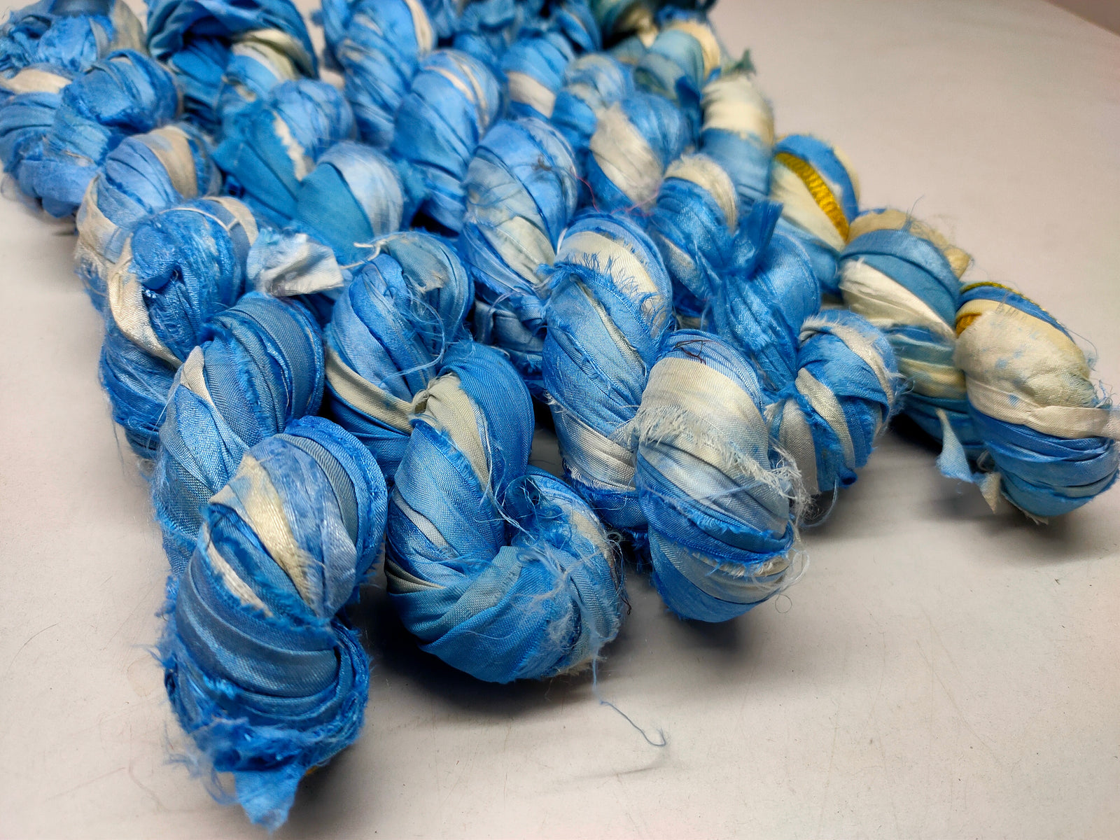 Recycled Sari Silk Ribbon - Cloud - SilkRouteIndia Recycled Sari SilK yarn, Recycled Sari Silk Ribbon, Recycled Sari yarn, Recycled Silk Ribbon,upcycled ribbon, upcycled yarn, Himalaya Silk Yarn, Recycle Sari silk,	Recycle Silk,	Yarn for Knitting,	Knitting Yarn,	Crochet Yarn,	handcrafted yarn,	recycle sari yarn,	Sari Silk Yarn, reused ribbon, recycled ribbon