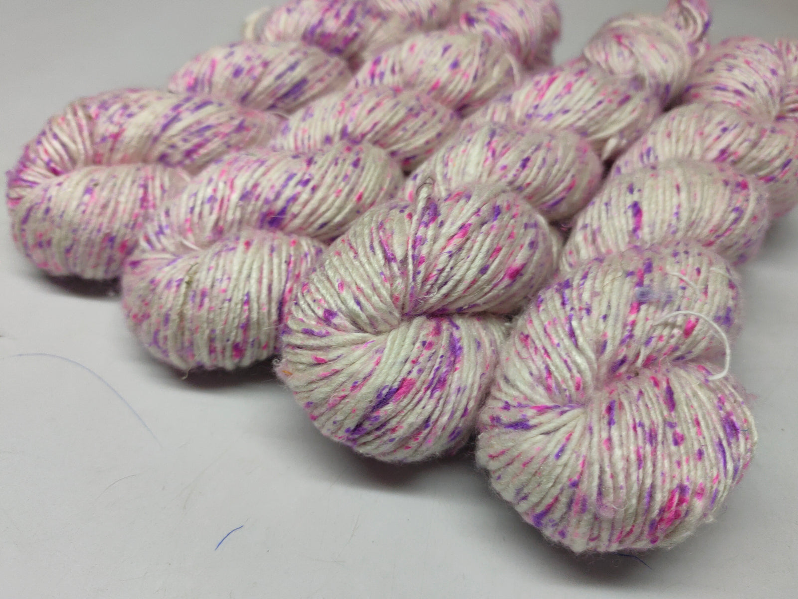 Mulberry Yarn Short Fiber - English Garden - SilkRouteIndia Mulberry Silk Yarn Short Fiber is a unique Silk Yarn ideal for Knitting. Mulberry Yarn is very soft and shiny. It is DK weight and is directly spun from the short fiber of Mulberry Silk Tops. It is a yarn of Natural Protein Fiber. Mulberry Yarn has compact structure, evenness, clean appearance, elegant luster, Good moisture-absorbing capability, good strength and elongation, with fine and soft fibers. It is Useful for Weaving and Knitting