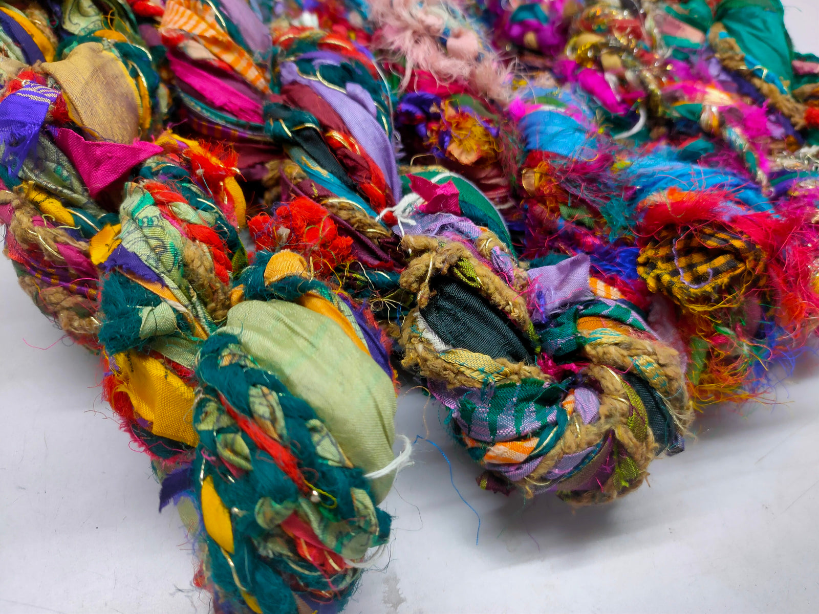 Recycled Yarn - Braided Lurex - SilkRouteIndia - Recycled Yarn - Braided lurex is available in multitude of colors. We fabricate Recycled Sari Yarn from the bi-product of sari and silk production units. The Yarn, available with us, is hand spun into bright hanks which is suitable for number of Handicrafts applications.