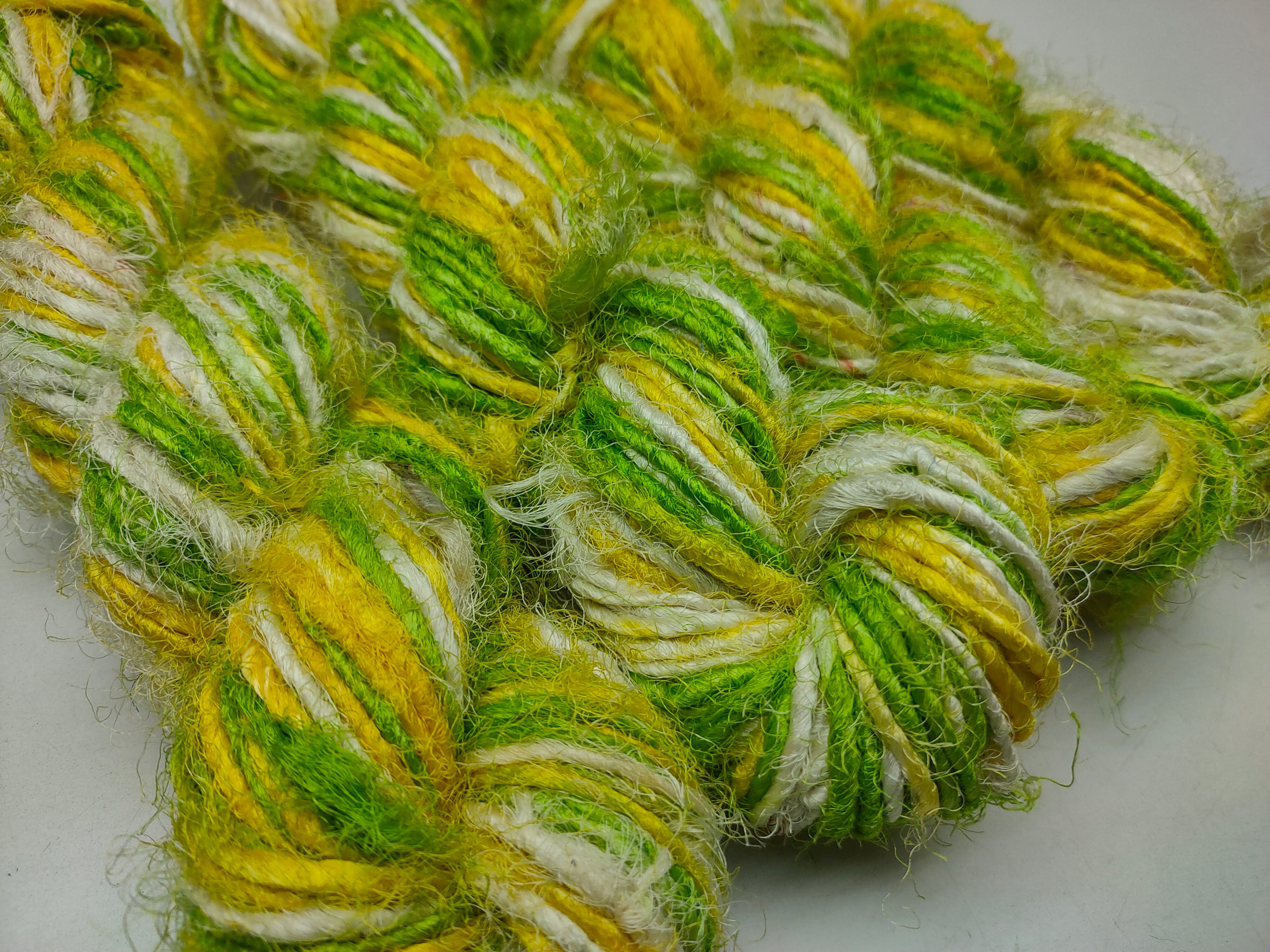 Recycled Sari Silk Yarn are the remnants of traditionally crafted Indian Saris and are extensively used in making hats, mittens, hued scarves, etc. We offer Recycle Sari Silk Yarn comprising of 100% and they are not over spun unlike some natural yarn.