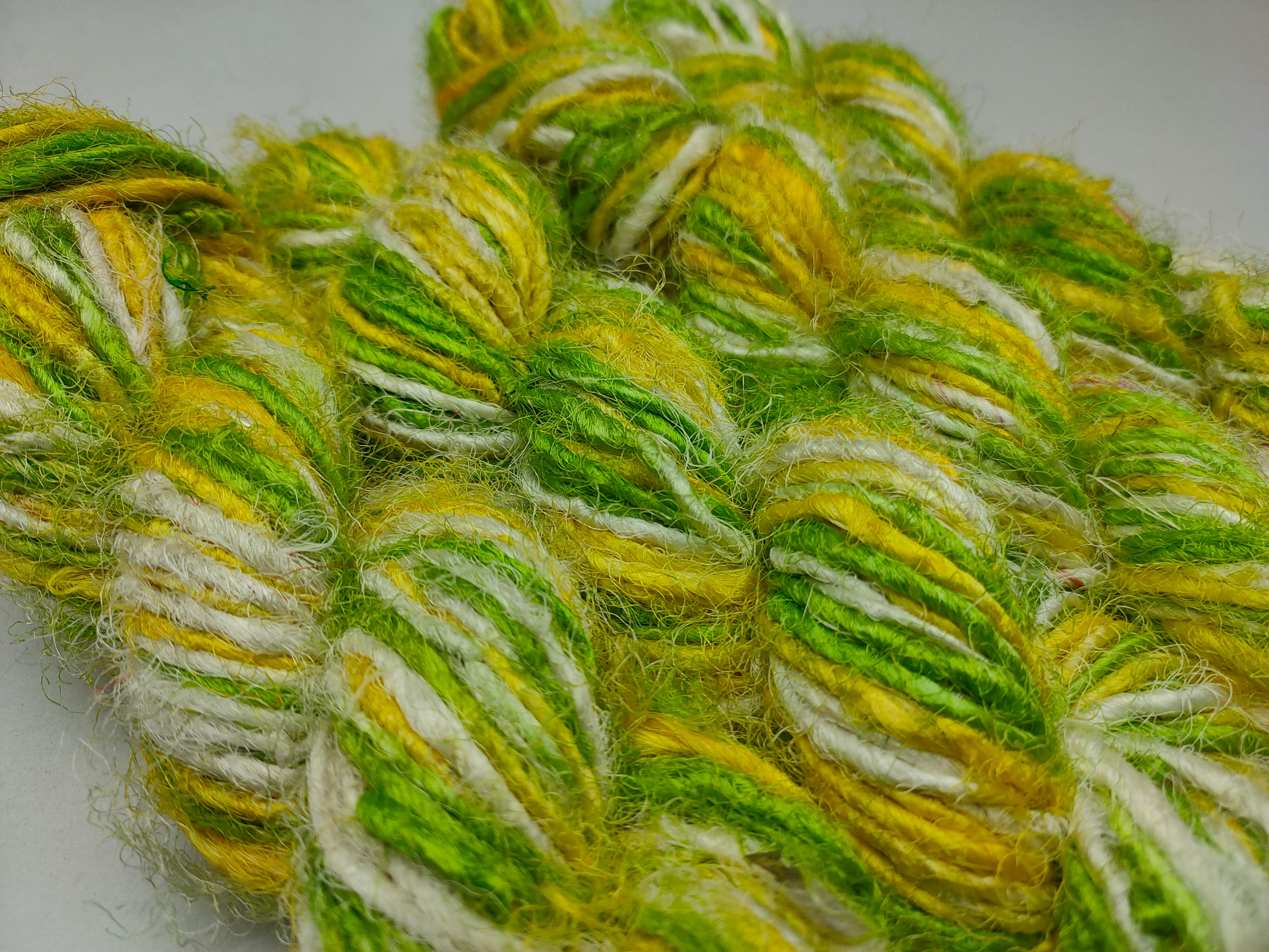 Recycled Sari Silk Yarn are the remnants of traditionally crafted Indian Saris and are extensively used in making hats, mittens, hued scarves, etc. We offer Recycle Sari Silk Yarn comprising of 100% and they are not over spun unlike some natural yarn.