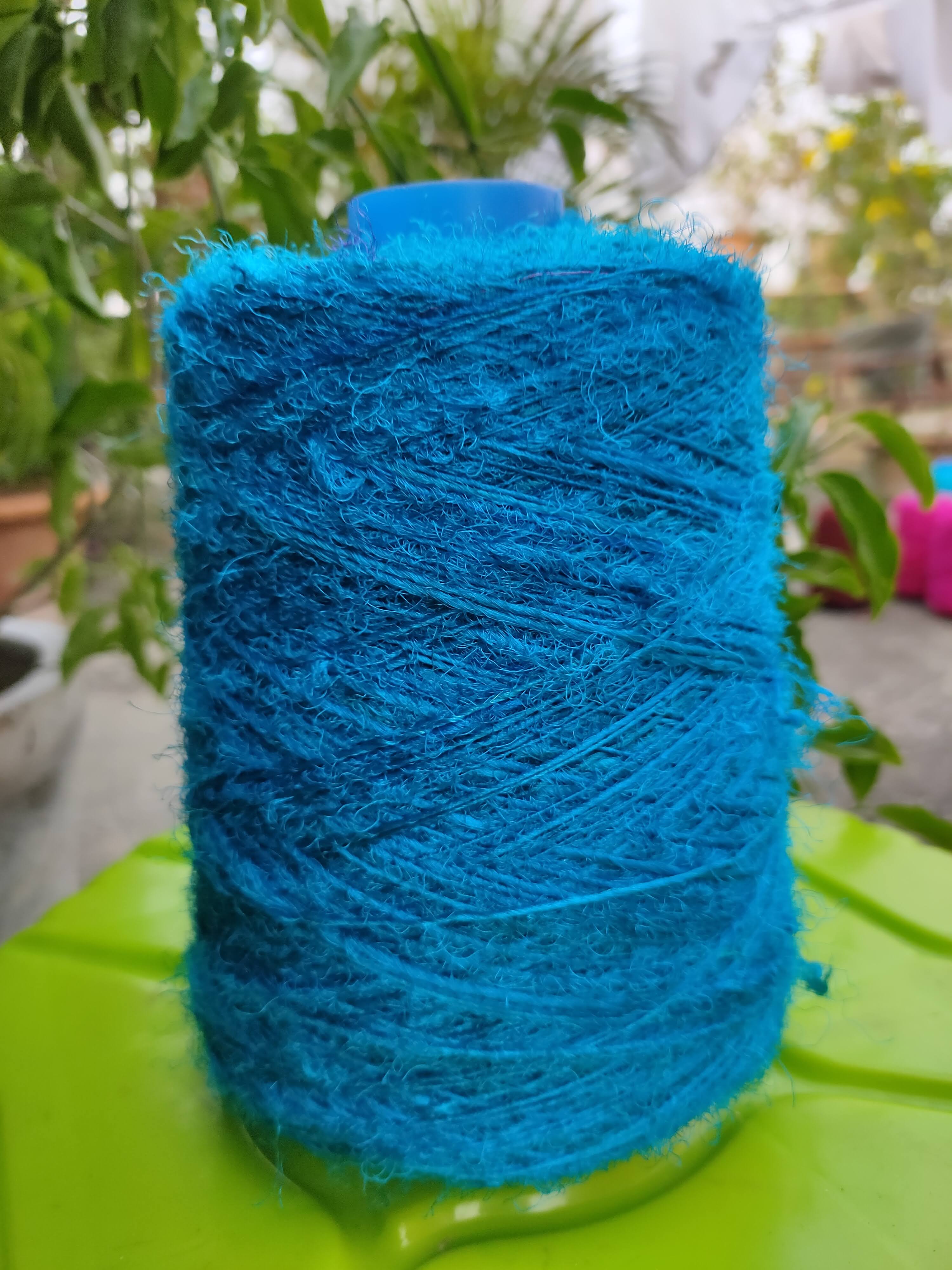 Recycle Sari Silk Yarn Prime - Sea Blue - SilkRouteIndia- Recycled Sari Silk Yarn Prime that is available in multitude of colors, and being premium, you get extra length of yarn in the same weight. We fabricate Recycled Sari Yarn from the bi-product of sari and silk production units. 