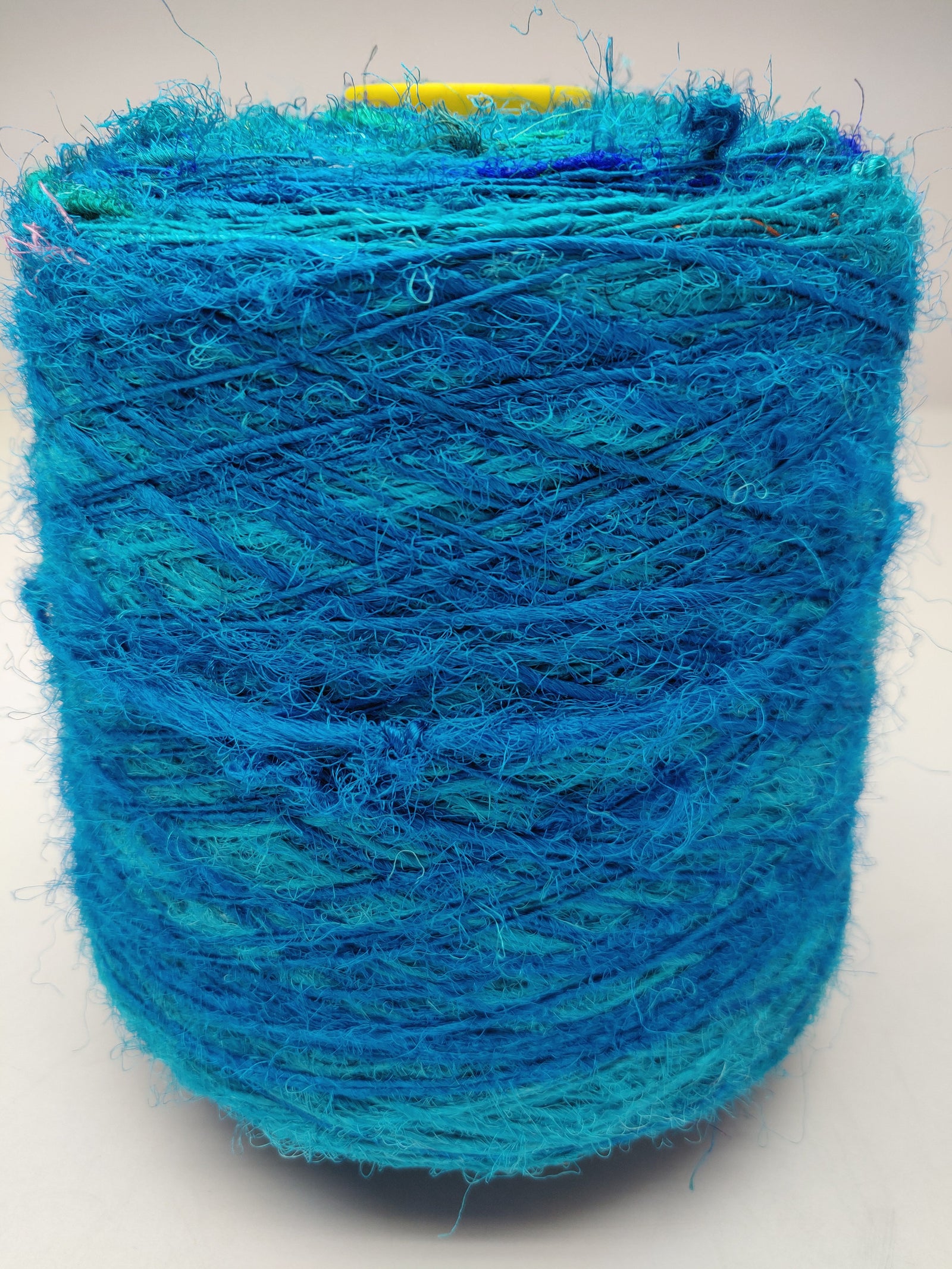 Recycle Sari Silk Yarn Prime - Sea Blue - SilkRouteIndia - Recycled Sari Silk Yarn Prime that is available in multitude of colors, and being premium, you get extra length of yarn in the same weight. We fabricate Recycled Sari Yarn from the bi-product of sari and silk production units.